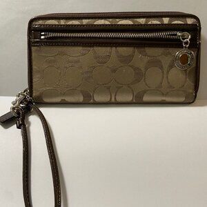 COACH Signature wallet/wristlet with brown patent leather trim